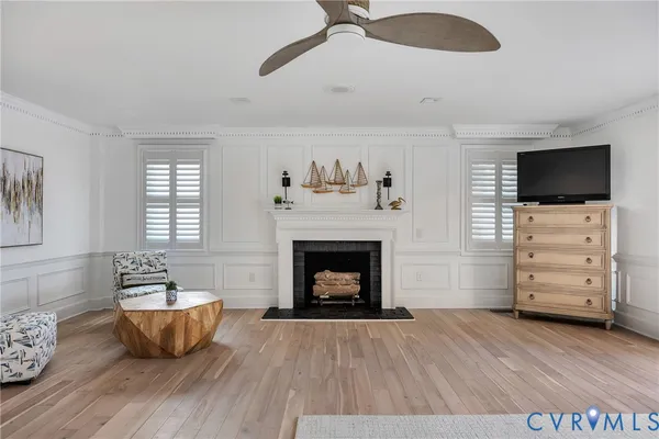 a living room with furniture fireplace and flat screen tv