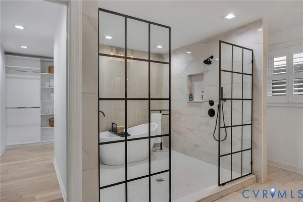 a bathroom with a glass shower door