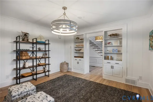 a view of a livingroom with furniture and natural light