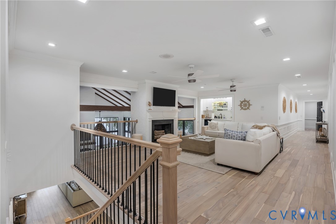 467 Daingerfield Road Tappahannock, VA 22560 - Photo 21 of 50 a living room with furniture a fireplace and a flat screen tv
