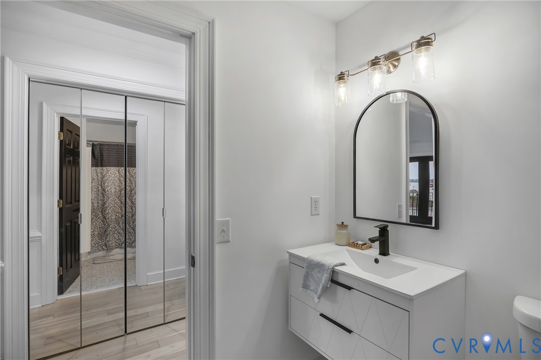 467 Daingerfield Road Tappahannock, VA 22560 - Photo 25 of 50 a bathroom with a toilet sink and mirror