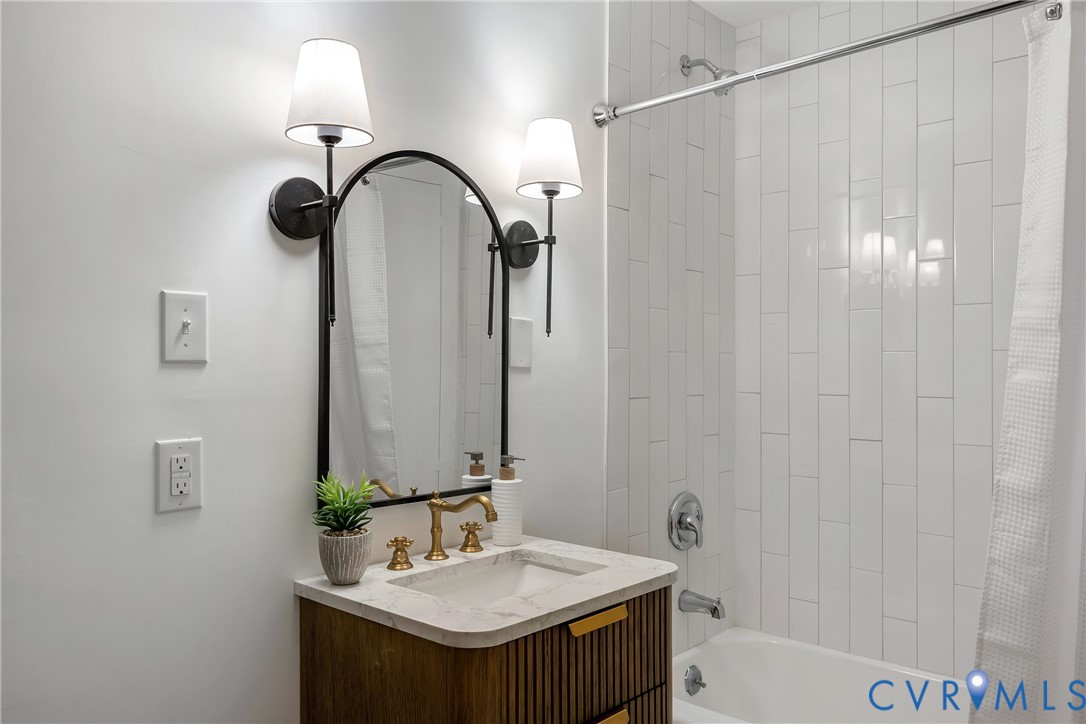 467 Daingerfield Road Tappahannock, VA 22560 - Photo 28 of 50 a bathroom with a sink and a mirror