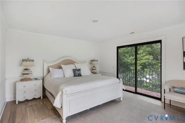 a bedroom with a bed and large window