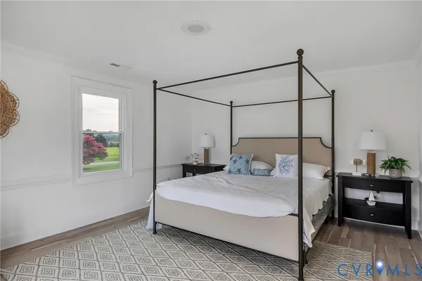 a bedroom with a bed and a mirror