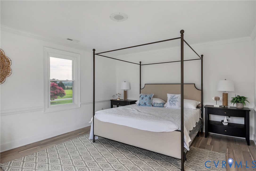 467 Daingerfield Road Tappahannock, VA 22560 - Photo 37 of 50 a bedroom with a bed and a mirror