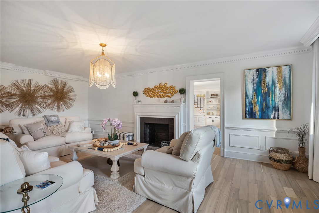 467 Daingerfield Road Tappahannock, VA 22560 - Photo 7 of 50 a living room with furniture chandelier and a fireplace