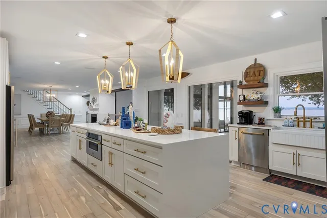 an open kitchen with cabinets and stainless steel appliances
