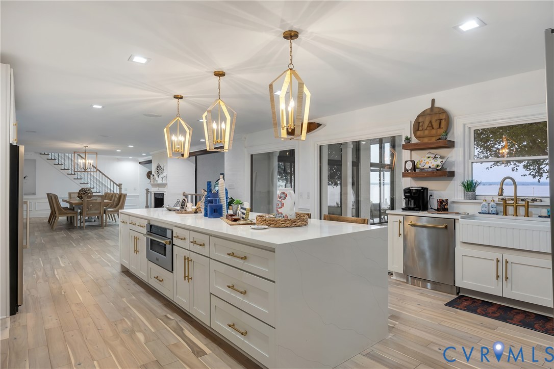 467 Daingerfield Road Tappahannock, VA 22560 - Photo 10 of 50 an open kitchen with cabinets and stainless steel appliances