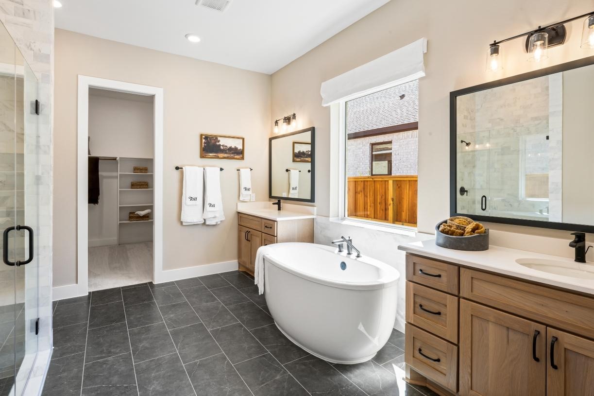 4807 Morning Spgs Drive Spring, TX 77386 - Photo 11 of 14 a spacious bathroom with a double vanity sink a mirror and a shower