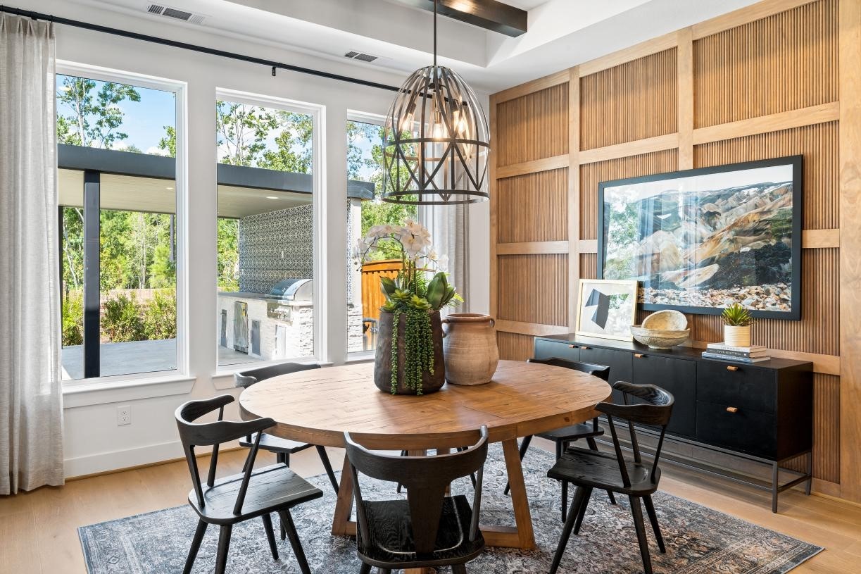 4807 Morning Spgs Drive Spring, TX 77386 - Photo 7 of 14 a dining room with furniture a chandelier and wooden floor