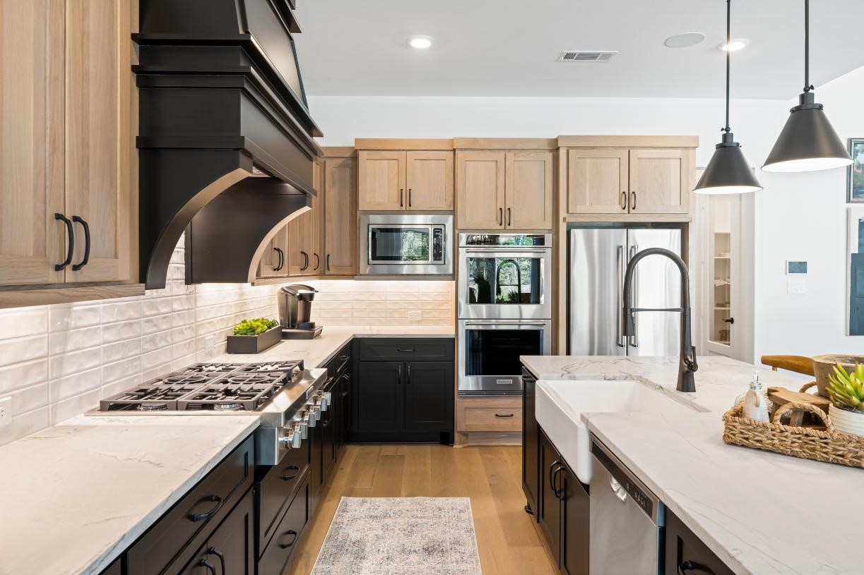 4807 Morning Spgs Drive Spring, TX 77386 - Photo 8 of 14 a kitchen with a stove a sink and a refrigerator