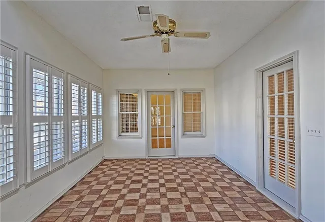 a view of a room with windows