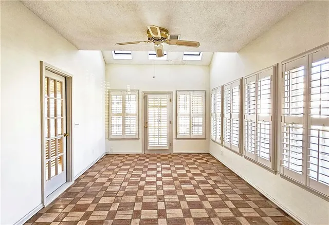 a view of an empty room with a window