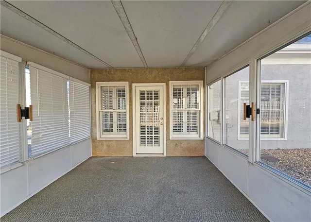 a view of an empty room with a balcony
