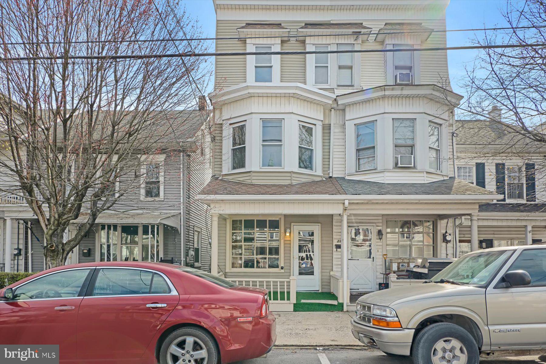 a front view of a house with parking space