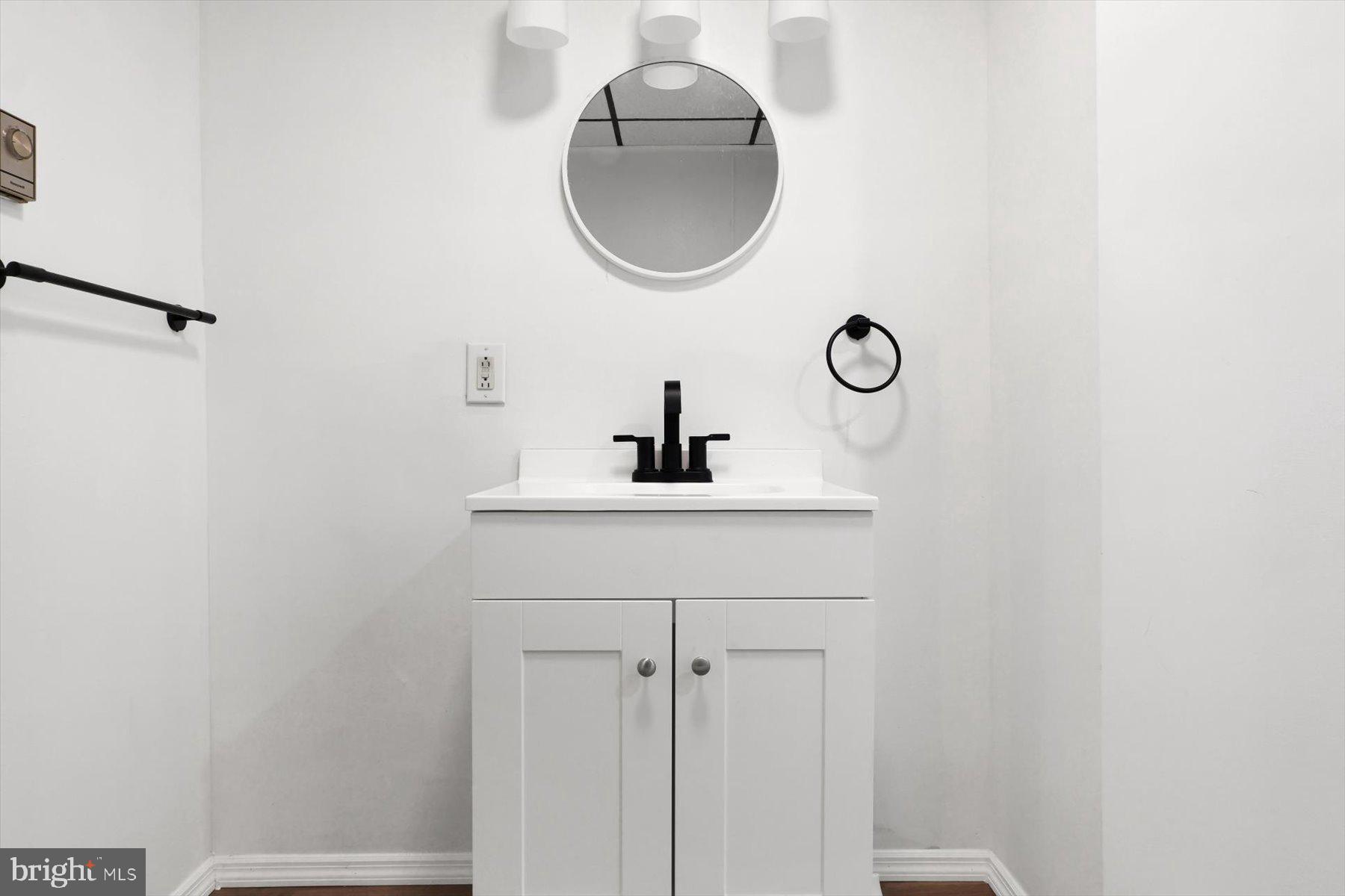 23 North 6th Street Shamokin, PA 17872 - Photo 20 of 27 a bathroom with a sink and a mirror
