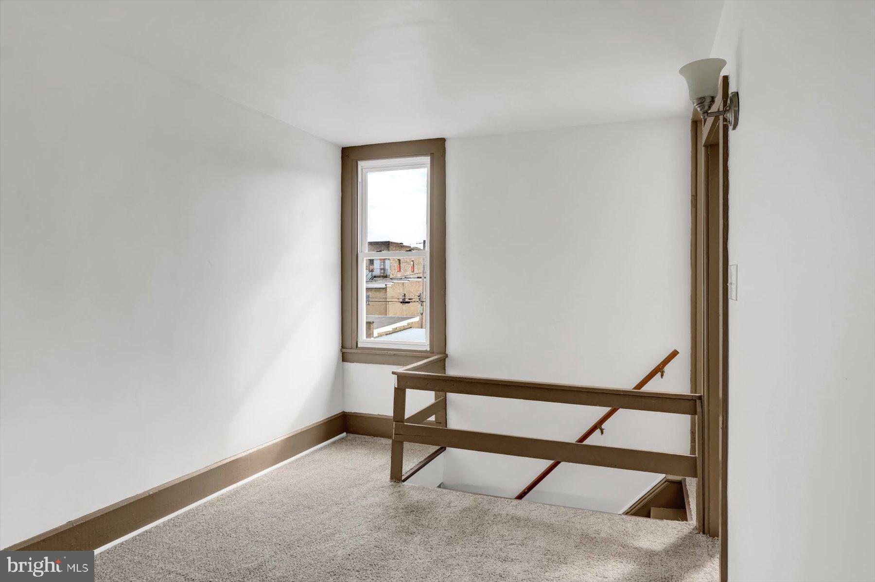 23 North 6th Street Shamokin, PA 17872 - Photo 22 of 27 a view of an empty room with a window