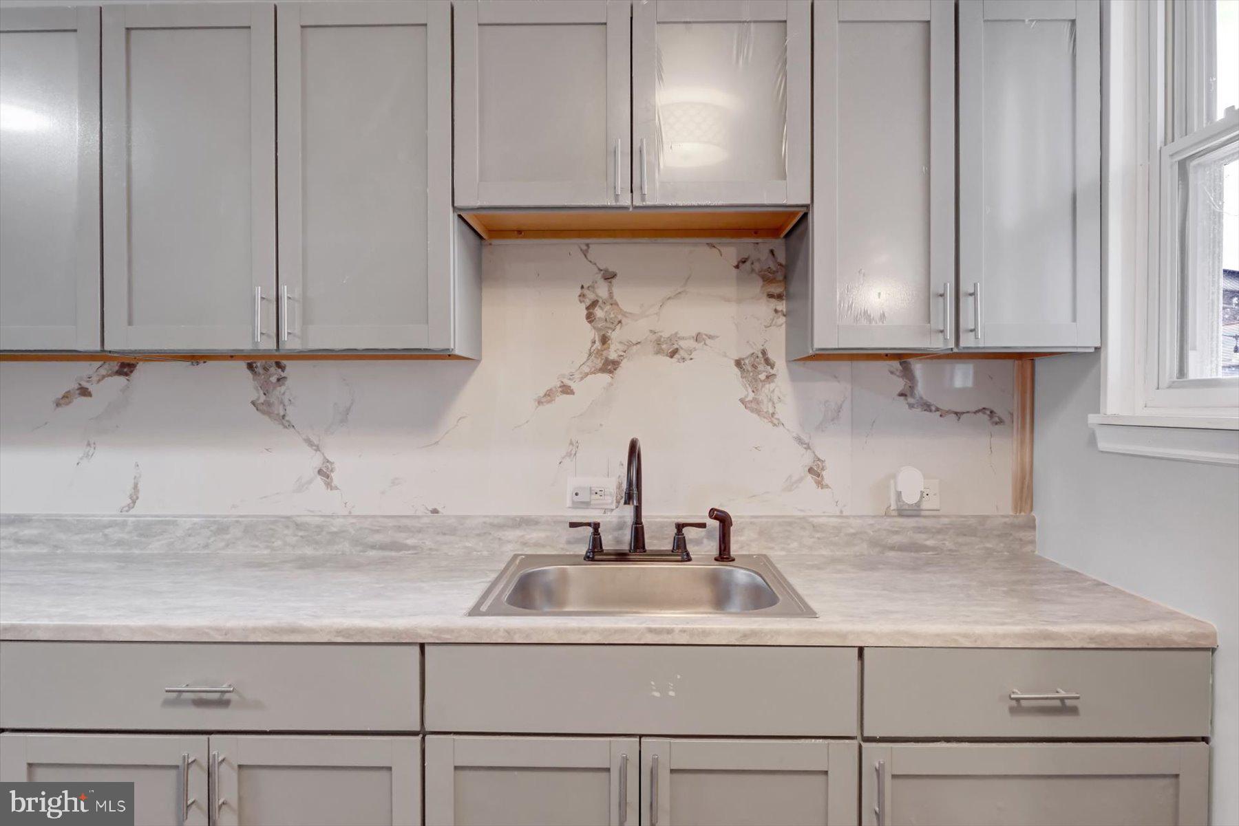 23 North 6th Street Shamokin, PA 17872 - Photo 10 of 27 a kitchen with a sink and cabinets