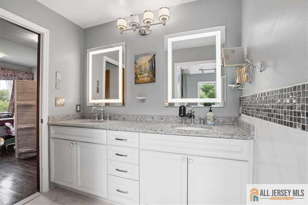 167 Federal Road Monroe Township, NJ 08831 - Photo 24 of 46 a bathroom with a granite countertop sink mirror and double
