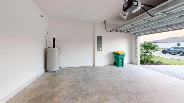 a kitchen with kitchen island a sink stainless steel appliances and cabinets