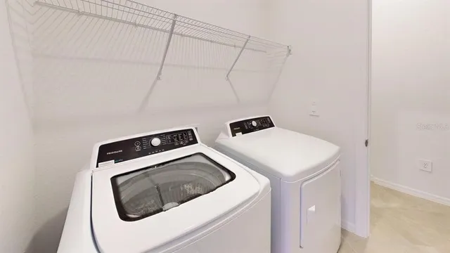 an empty room with windows and entrance