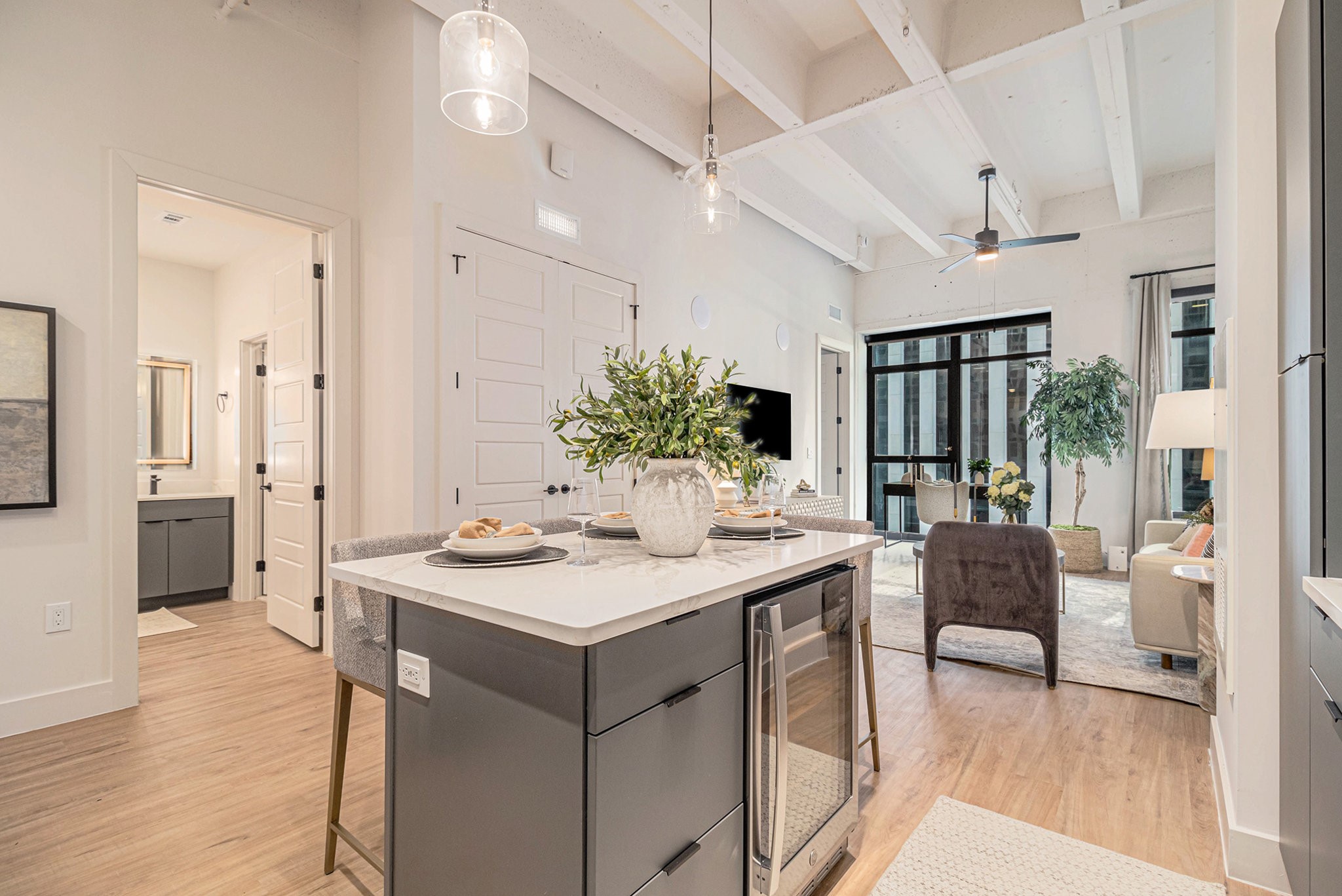 1801 Smith Street, Unit 1701 Houston, TX 77002 - Photo 3 of 25 a view of a dining room with furniture and wooden floor