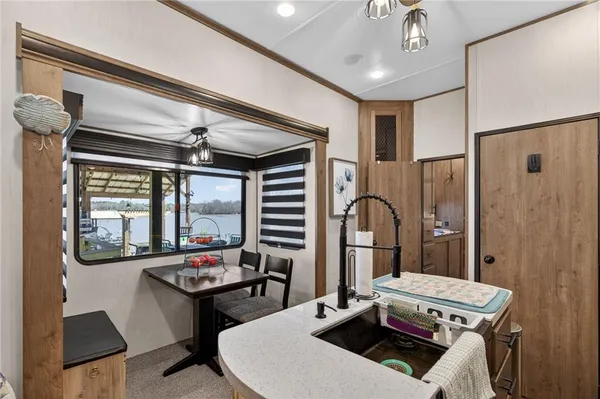 a living room with furniture a window and a chandelier