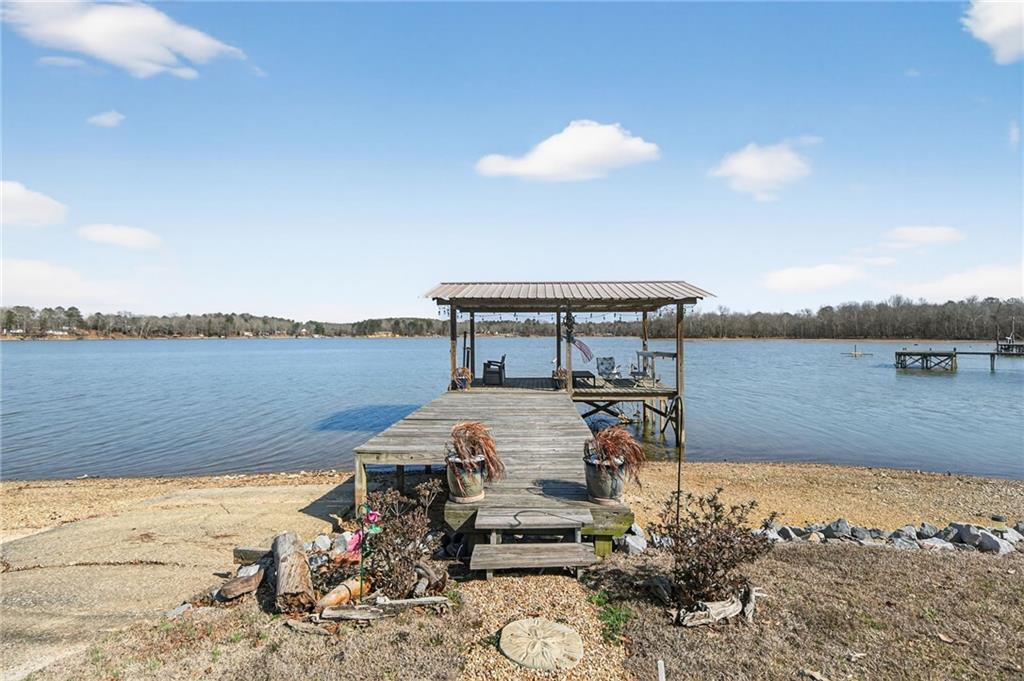 617 County Road 432 Centre, AL 35960 - Photo 27 of 48 a view of a lake with a table and chairs