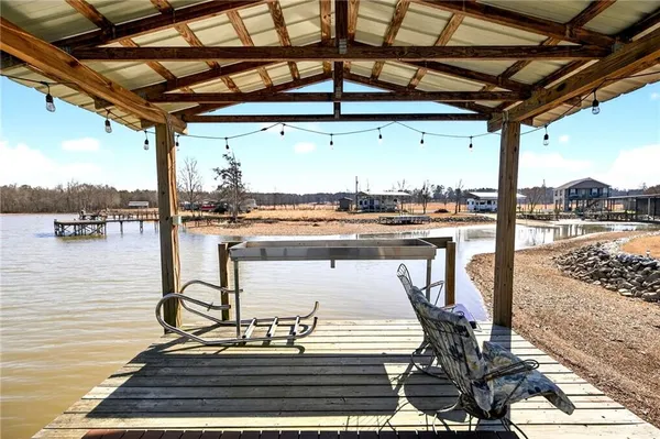 a view of a swimming pool with outdoor seating