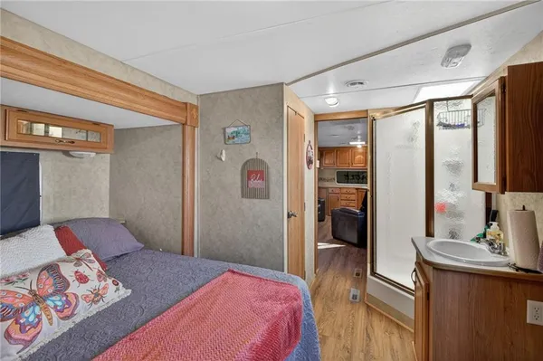 a bedroom with a large bed and a dresser