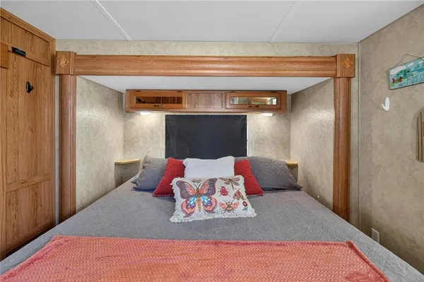 a bedroom with a bed and a couch