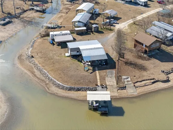 an aerial view of a house with outdoor space