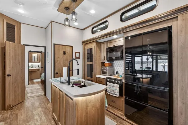 a kitchen with a stove and refrigerator