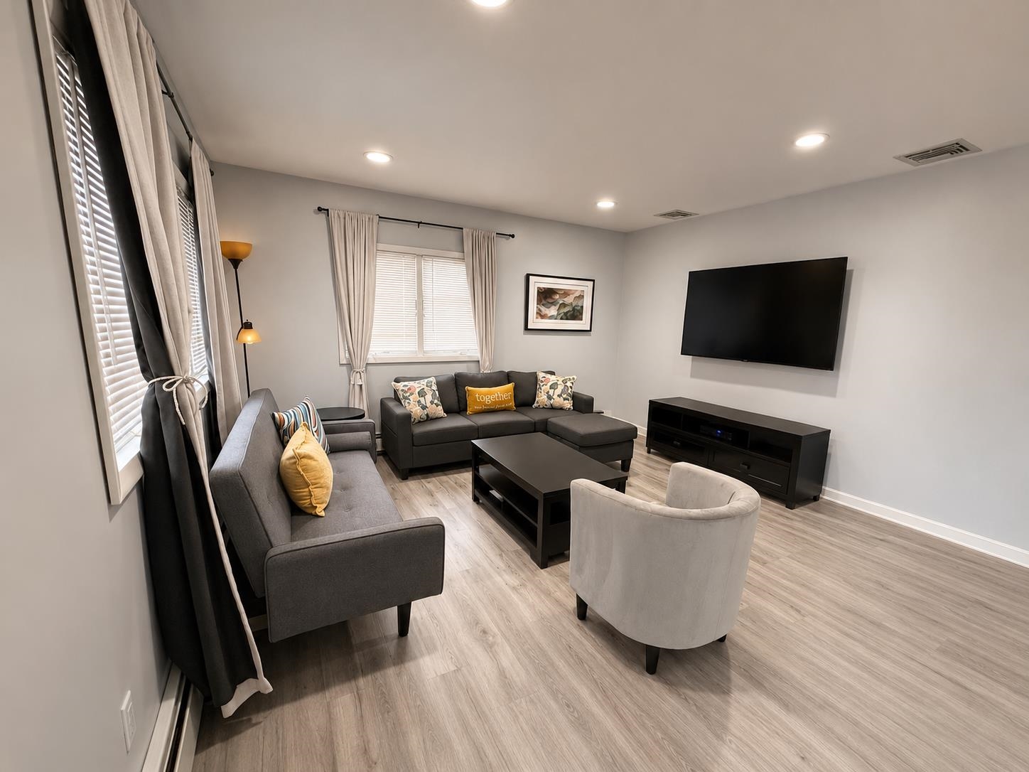32 Franklin Street, Unit 2 Hackensack, NJ 07601 - Photo 12 of 13 a living room with furniture and a flat screen tv