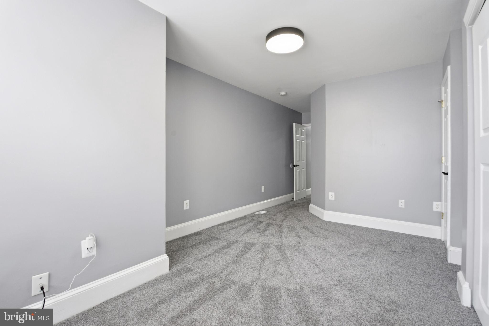 1806 East Lafayette Avenue Baltimore, MD 21213 - Photo 17 of 33 a view of an empty room with a window