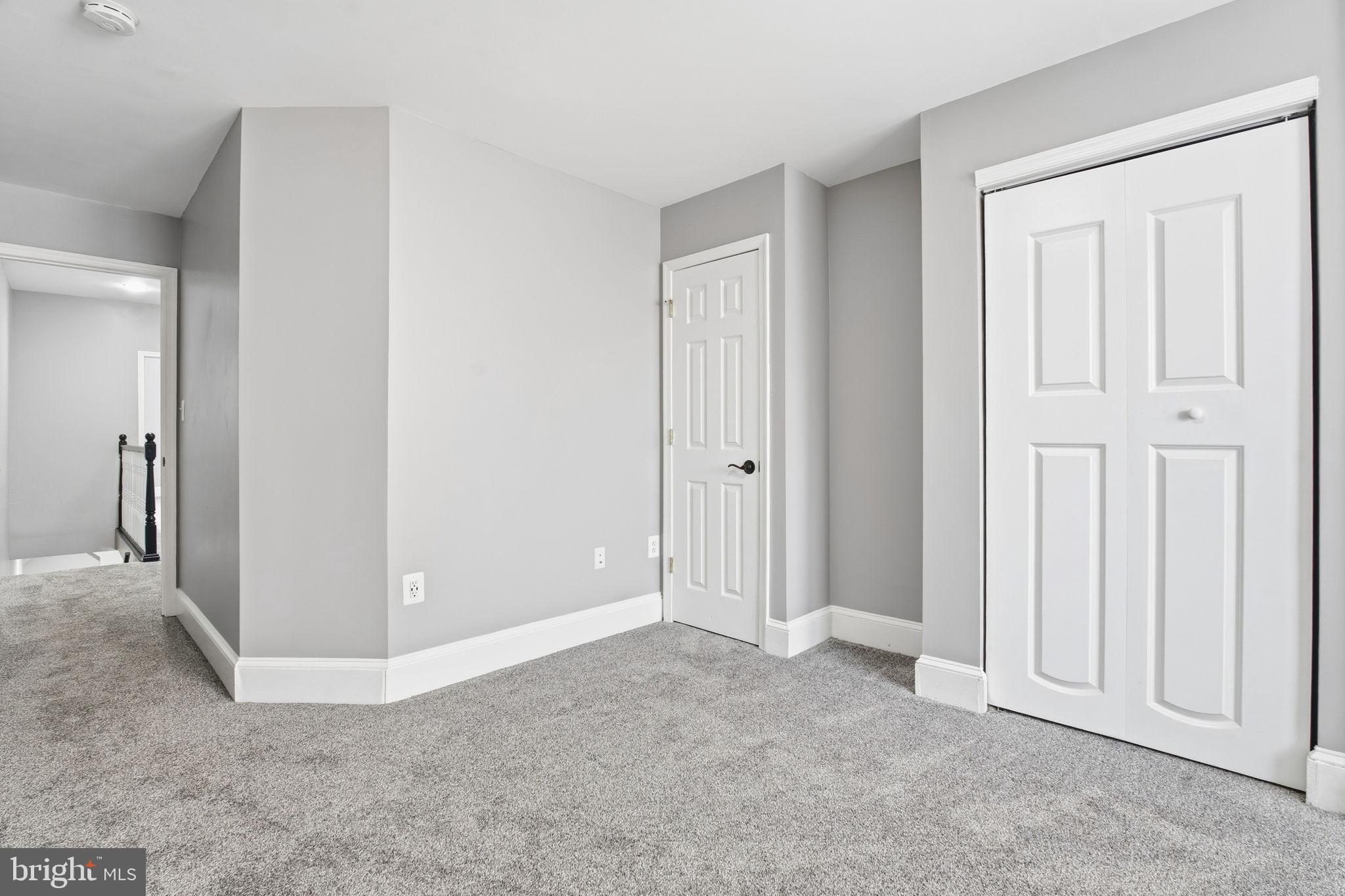 1806 East Lafayette Avenue Baltimore, MD 21213 - Photo 24 of 33 an empty room with windows and closet