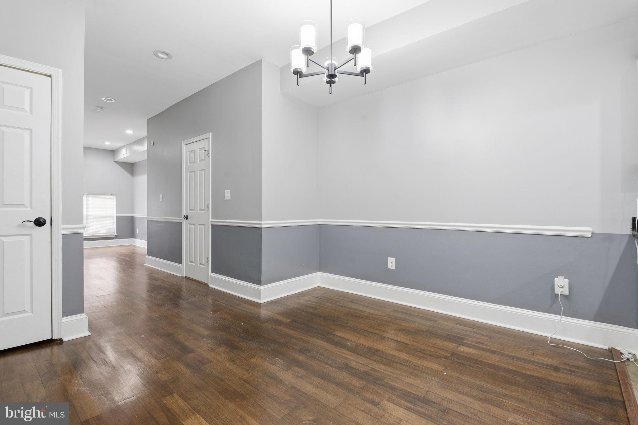 1806 East Lafayette Avenue Baltimore, MD 21213 - Photo 3 of 33 a view of a room with wooden floor
