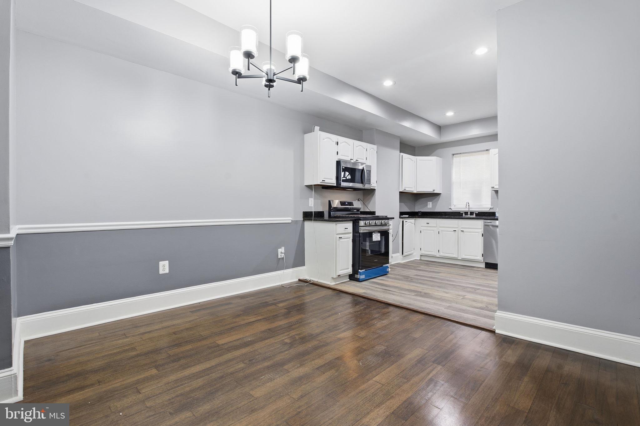1806 East Lafayette Avenue Baltimore, MD 21213 - Photo 9 of 33 a view of kitchen with refrigerator microwave and stove