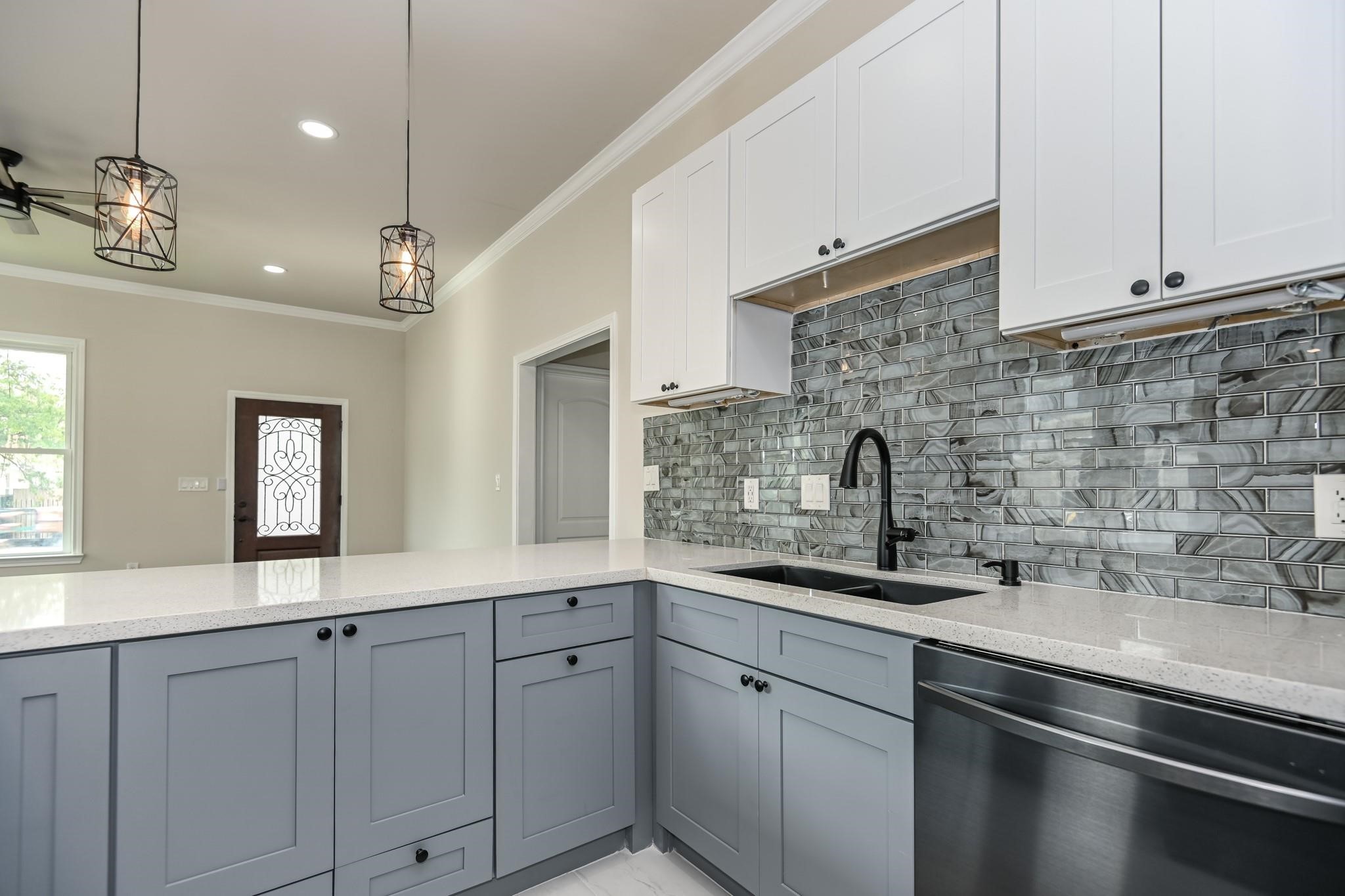 2902 Houston Avenue Houston, TX 77009 - Photo 22 of 42 a kitchen with a sink and cabinets