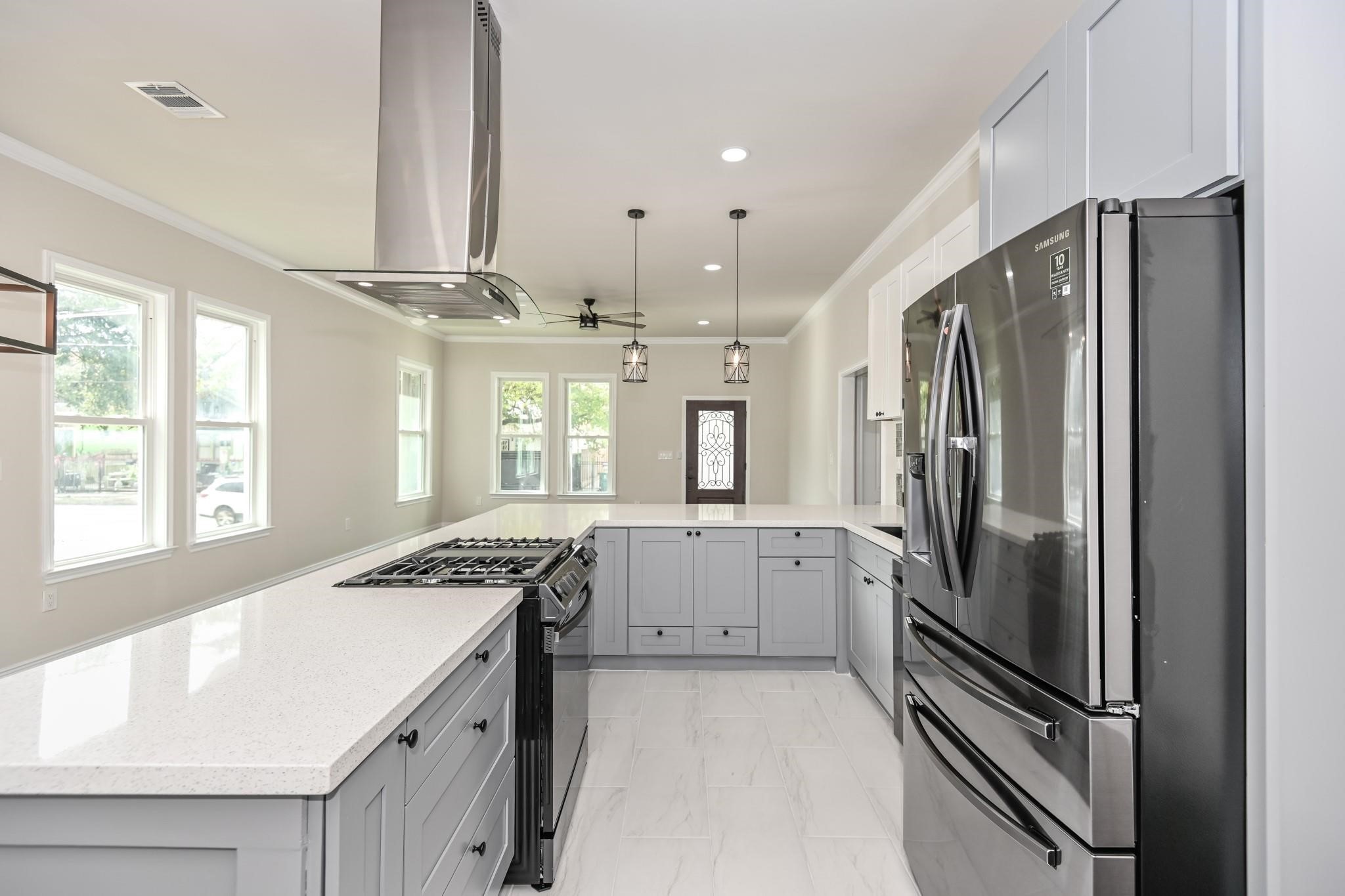 2902 Houston Avenue Houston, TX 77009 - Photo 23 of 42 a kitchen with a refrigerator and a sink