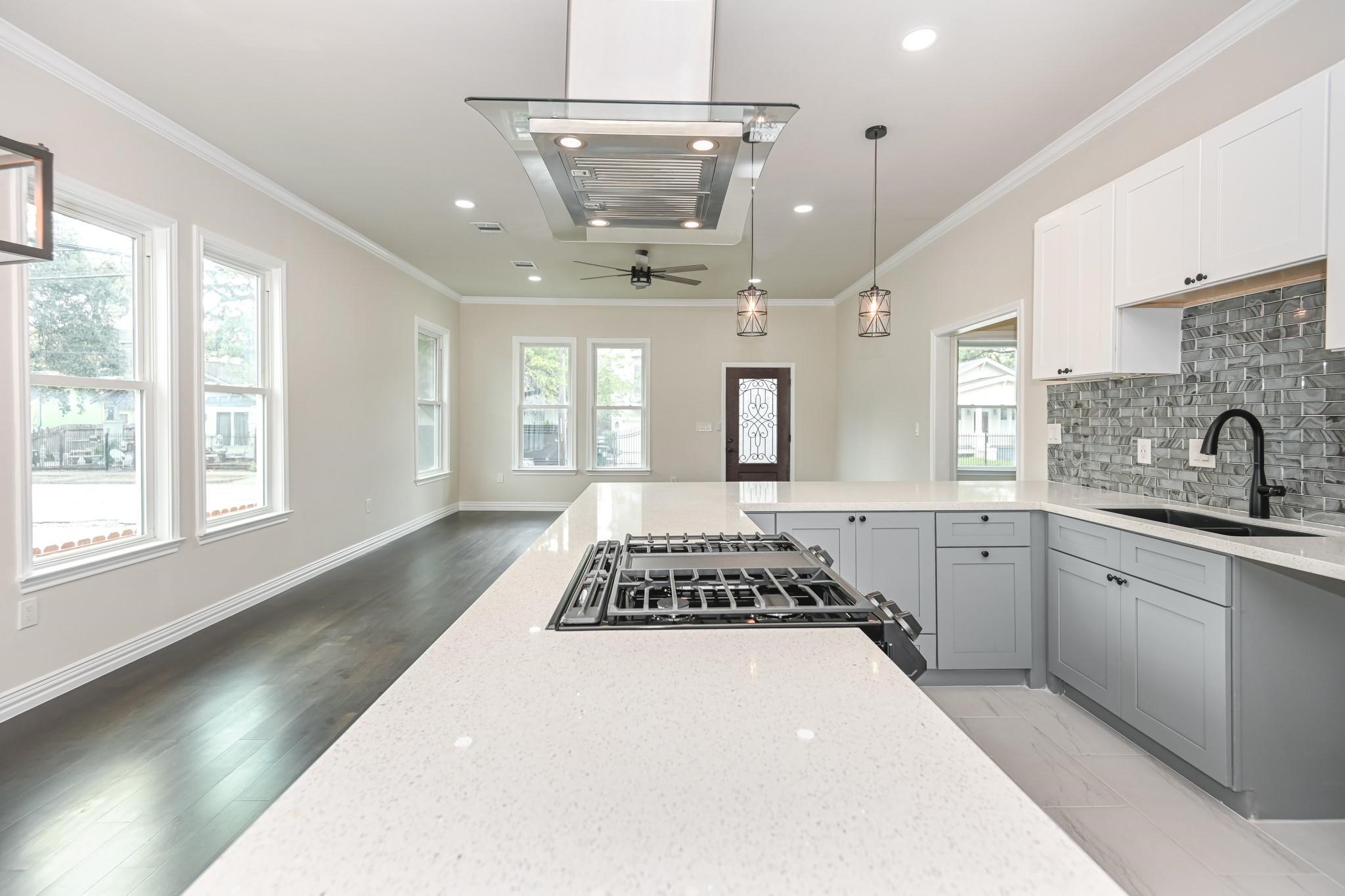 2902 Houston Avenue Houston, TX 77009 - Photo 25 of 42 a large kitchen with a large window a sink stainless steel appliances and cabinets
