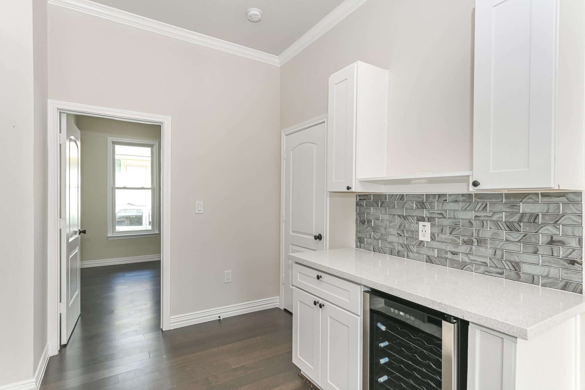 2902 Houston Avenue Houston, TX 77009 - Photo 27 of 42 a kitchen with granite countertop a sink and cabinets