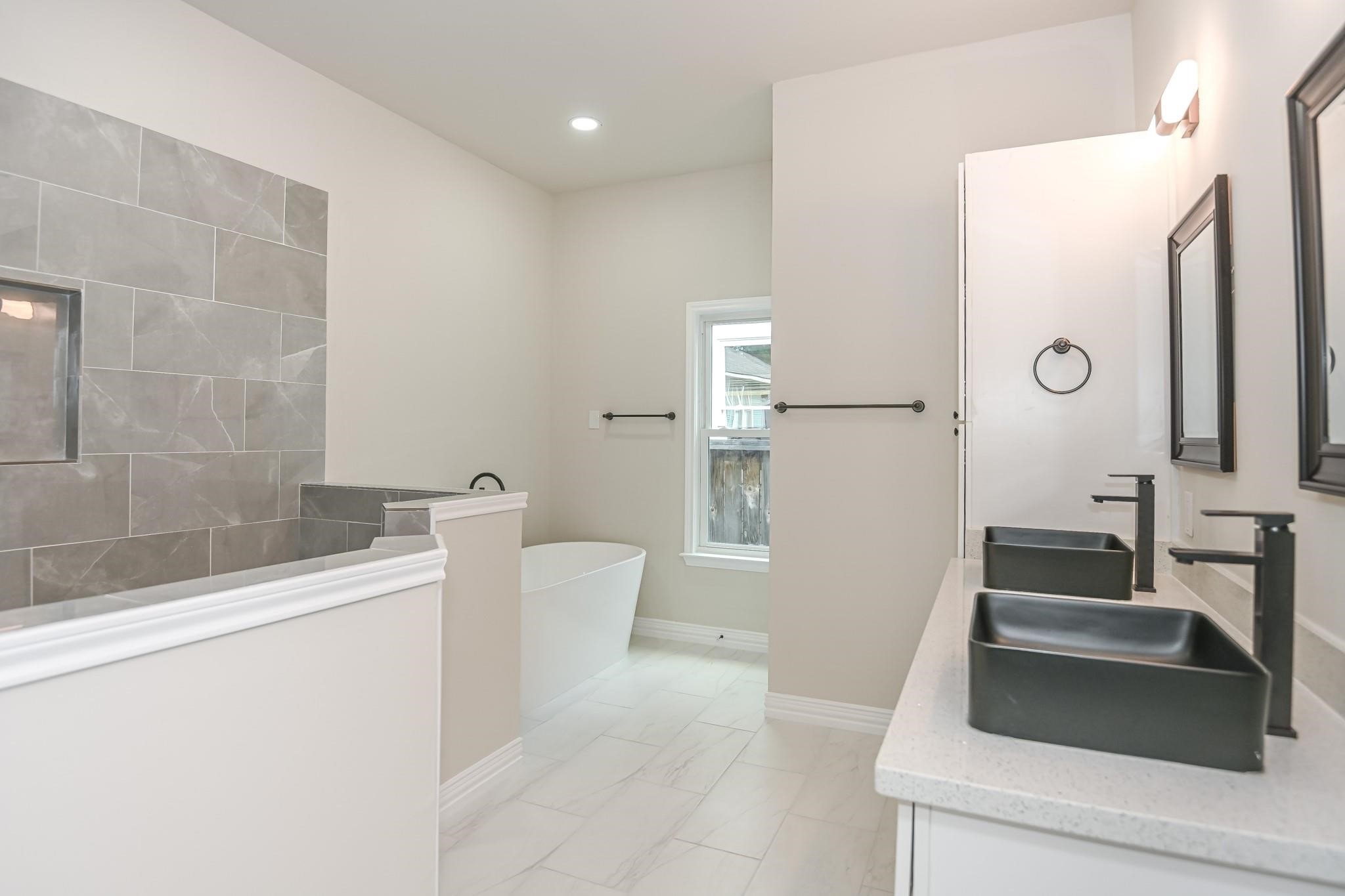 2902 Houston Avenue Houston, TX 77009 - Photo 29 of 42 a bathroom with a sink a toilet and shower