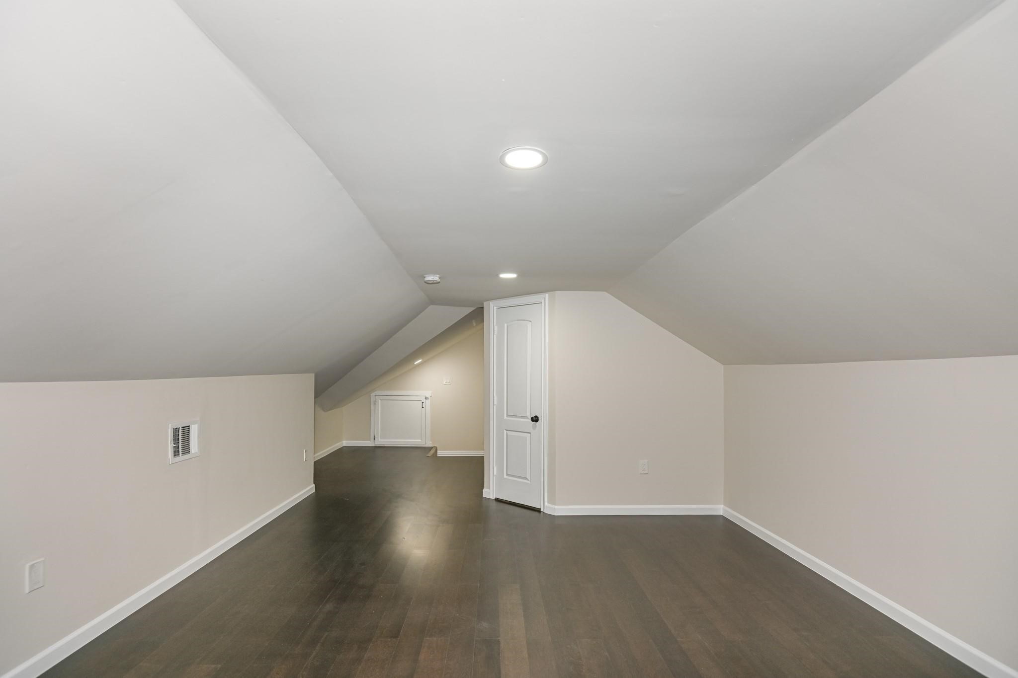2902 Houston Avenue Houston, TX 77009 - Photo 41 of 42 an empty room with wooden floor and windows