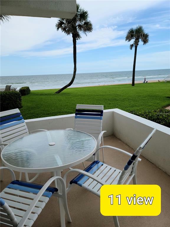 815 Ocean Shore Boulevard, Unit 11 Ormond Beach, FL 32176 - Photo 1 of 15 a view of outdoor space and seating area