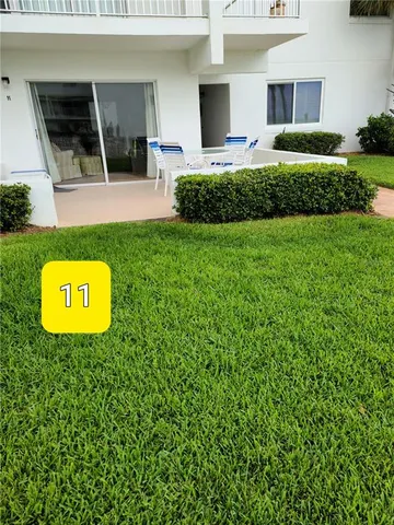 a view of a house with a backyard space