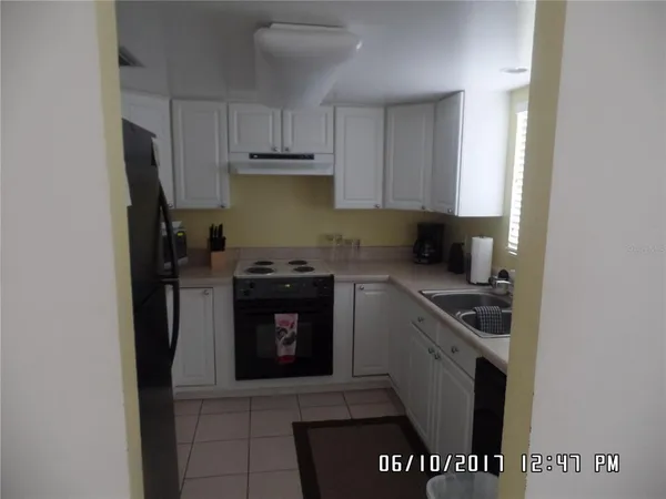 a kitchen with a stove and a refrigerator