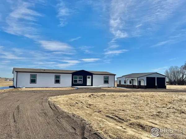 a view of a house with a big yard