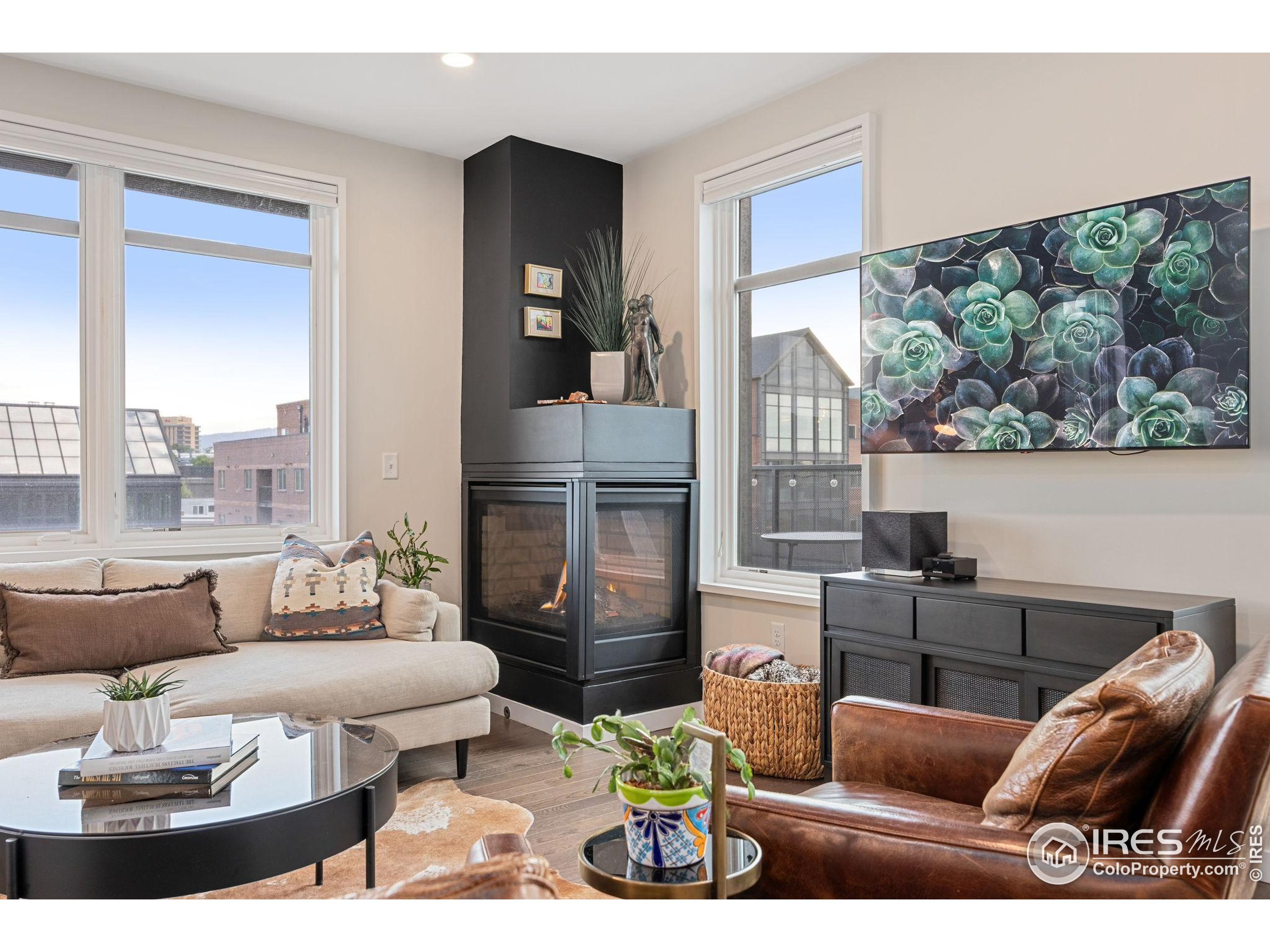 401 Linden Street, Unit 307 Fort Collins, CO 80524 - Photo 11 of 47 a living room with furniture and a large window