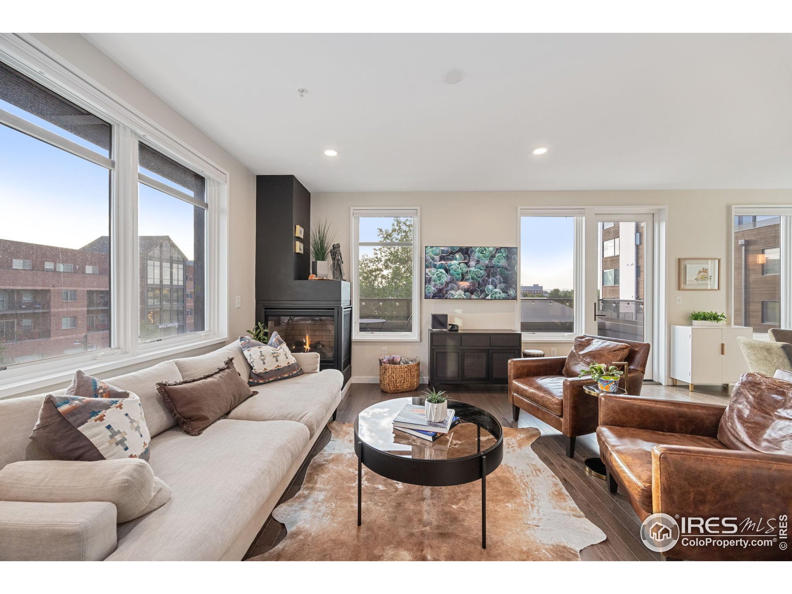 401 Linden Street, Unit 307 Fort Collins, CO 80524 - Photo 12 of 47 a living room with furniture and a large window